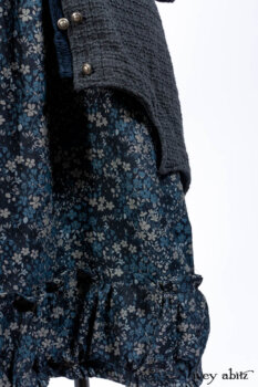 Chittister Duster Coat in Slate Embroidered Windowpane Weave; Gabled Shirt Jacket in Hudson River Silky Crinkled Weave; Gabled Frock in Hudson River Floral Jacquard; Cilla Slip Frock in Slate Washed Knit.