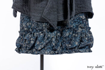 Chittister Duster Coat in Slate Embroidered Windowpane Weave; Gabled Shirt Jacket in Hudson River Silky Crinkled Weave; Gabled Frock in Hudson River Floral Jacquard; Cilla Slip Frock in Slate Washed Knit.