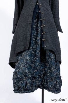 Chittister Duster Coat in Slate Embroidered Windowpane Weave; Gabled Shirt Jacket in Hudson River Silky Crinkled Weave; Gabled Frock in Hudson River Floral Jacquard; Cilla Slip Frock in Slate Washed Knit.