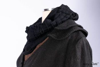 Everett Duster Coat in Mansard Roof Coat Weave; Lydia Neck Wrap and Lydia Arm Wraps in Signature Black Washed Knit; Roebling Frock in Brownstone Washed Linen; Cilla Slip Frock in Signature Black Washed Knit.