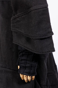 Everett Duster Coat in Mansard Roof Coat Weave; Lydia Neck Wrap and Lydia Arm Wraps in Signature Black Washed Knit; Roebling Frock in Brownstone Washed Linen; Cilla Slip Frock in Signature Black Washed Knit.