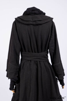 Everett Duster Coat in Mansard Roof Coat Weave; Lydia Neck Wrap and Lydia Arm Wraps in Signature Black Washed Knit; Roebling Frock in Brownstone Washed Linen; Cilla Slip Frock in Signature Black Washed Knit.