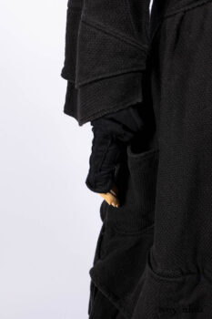 Everett Duster Coat in Mansard Roof Coat Weave; Lydia Neck Wrap and Lydia Arm Wraps in Signature Black Washed Knit; Roebling Frock in Brownstone Washed Linen; Cilla Slip Frock in Signature Black Washed Knit.