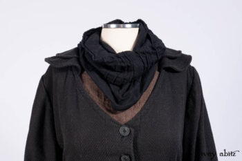Everett Duster Coat in Mansard Roof Coat Weave; Lydia Neck Wrap and Lydia Arm Wraps in Signature Black Washed Knit; Roebling Frock in Brownstone Washed Linen; Cilla Slip Frock in Signature Black Washed Knit.