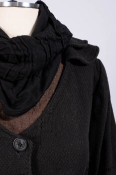 Everett Duster Coat in Mansard Roof Coat Weave; Lydia Neck Wrap and Lydia Arm Wraps in Signature Black Washed Knit; Roebling Frock in Brownstone Washed Linen; Cilla Slip Frock in Signature Black Washed Knit.
