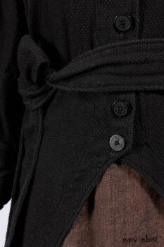 Everett Duster Coat in Mansard Roof Coat Weave; Lydia Neck Wrap and Lydia Arm Wraps in Signature Black Washed Knit; Roebling Frock in Brownstone Washed Linen; Cilla Slip Frock in Signature Black Washed Knit.