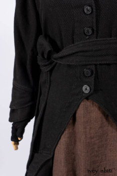 Everett Duster Coat in Mansard Roof Coat Weave; Lydia Neck Wrap and Lydia Arm Wraps in Signature Black Washed Knit; Roebling Frock in Brownstone Washed Linen; Cilla Slip Frock in Signature Black Washed Knit.