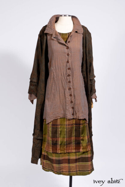 Harrison Duster Coat in Brownstone Crewel Work Weave; Ellis Shirt in Rooftop Sunset Washed Voile; Harrison Frock in Central Park Brownstone Plaid Silk; Cilla Slip Frock in Signature Black Ribbed Knit.