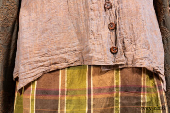 Harrison Duster Coat in Brownstone Crewel Work Weave; Ellis Shirt in Rooftop Sunset Washed Voile; Harrison Frock in Central Park Brownstone Plaid Silk; Cilla Slip Frock in Signature Black Ribbed Knit.