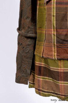 Harrison Duster Coat in Brownstone Crewel Work Weave; Ellis Shirt in Rooftop Sunset Washed Voile; Harrison Frock in Central Park Brownstone Plaid Silk; Cilla Slip Frock in Signature Black Ribbed Knit.