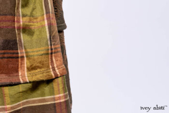 Harrison Duster Coat in Brownstone Crewel Work Weave; Ellis Shirt in Rooftop Sunset Washed Voile; Harrison Frock in Central Park Brownstone Plaid Silk; Cilla Slip Frock in Signature Black Ribbed Knit.