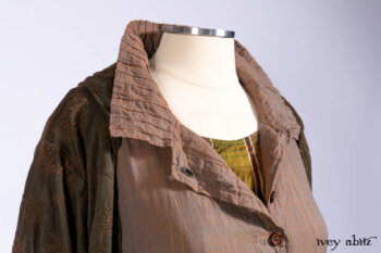 Harrison Duster Coat in Brownstone Crewel Work Weave; Ellis Shirt in Rooftop Sunset Washed Voile; Harrison Frock in Central Park Brownstone Plaid Silk; Cilla Slip Frock in Signature Black Ribbed Knit.