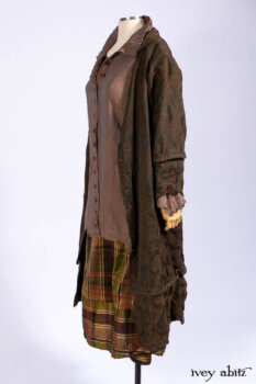 Harrison Duster Coat in Brownstone Crewel Work Weave; Ellis Shirt in Rooftop Sunset Washed Voile; Harrison Frock in Central Park Brownstone Plaid Silk; Cilla Slip Frock in Signature Black Ribbed Knit.