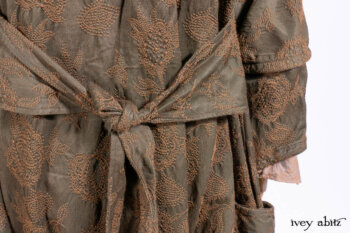 Harrison Duster Coat in Brownstone Crewel Work Weave; Ellis Shirt in Rooftop Sunset Washed Voile; Harrison Frock in Central Park Brownstone Plaid Silk; Cilla Slip Frock in Signature Black Ribbed Knit.
