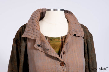 Harrison Duster Coat in Brownstone Crewel Work Weave; Ellis Shirt in Rooftop Sunset Washed Voile; Harrison Frock in Central Park Brownstone Plaid Silk; Cilla Slip Frock in Signature Black Ribbed Knit.