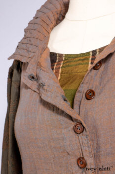Harrison Duster Coat in Brownstone Crewel Work Weave; Ellis Shirt in Rooftop Sunset Washed Voile; Harrison Frock in Central Park Brownstone Plaid Silk; Cilla Slip Frock in Signature Black Ribbed Knit.