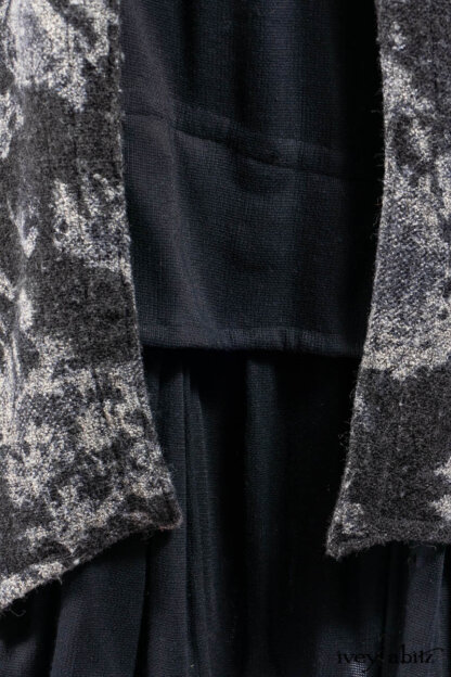 Monceau Duster Coat in Mansard Roof Washed Floral Woolen Weave; Lydia Neck Wrap in Slate Washed Knit; Blanchefleur Dress in Mansard Roof Washed Weave; Cilla Slip Frock in Signature Black Ribbed Knit; Porte Cochere Sash in Mansard Roof Washed Floral Woolen Weave.
