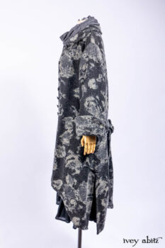 Monceau Duster Coat in Mansard Roof Washed Floral Woolen Weave; Lydia Neck Wrap in Slate Washed Linen; Blanchefleur Dress in Mansard Roof Washed Weave; Cilla Slip Frock in Signature Black Ribbed Knit; Porte Cochere Sash in Mansard Roof Washed Floral Woolen Weave.