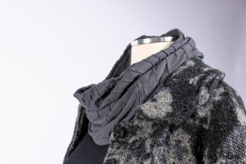 Monceau Duster Coat in Mansard Roof Washed Floral Woolen Weave; Lydia Neck Wrap in Slate Washed Linen; Blanchefleur Dress in Mansard Roof Washed Weave; Cilla Slip Frock in Signature Black Ribbed Knit; Porte Cochere Sash in Mansard Roof Washed Floral Woolen Weave.
