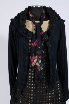 Limited Edition Coulson Cardigan in Signature Black Ribbed Knit; Clotaire Sash in Riverside Floral Silk Chiffon; Bedloe Frock in Mansard Roof Open Woolen Weave; Everett Frock in Uptown Washed Weave.