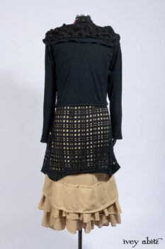 Limited Edition Coulson Cardigan in Signature Black Ribbed Knit; Clotaire Sash in Riverside Floral Silk Chiffon; Bedloe Frock in Mansard Roof Open Woolen Weave; Everett Frock in Uptown Washed Weave.