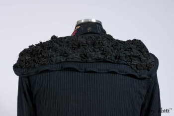 Limited Edition Coulson Cardigan in Signature Black Ribbed Knit; Clotaire Sash in Riverside Floral Silk Chiffon; Bedloe Frock in Mansard Roof Open Woolen Weave; Everett Frock in Uptown Washed Weave.