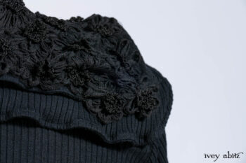 Limited Edition Coulson Cardigan in Signature Black Ribbed Knit; Clotaire Sash in Riverside Floral Silk Chiffon; Bedloe Frock in Mansard Roof Open Woolen Weave; Everett Frock in Uptown Washed Weave.