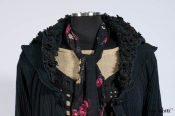 Limited Edition Coulson Cardigan in Signature Black Ribbed Knit; Clotaire Sash in Riverside Floral Silk Chiffon; Bedloe Frock in Mansard Roof Open Woolen Weave; Everett Frock in Uptown Washed Weave.