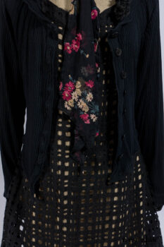 Limited Edition Coulson Cardigan in Signature Black Ribbed Knit; Clotaire Sash in Riverside Floral Silk Chiffon; Bedloe Frock in Mansard Roof Open Woolen Weave; Everett Frock in Uptown Washed Weave.