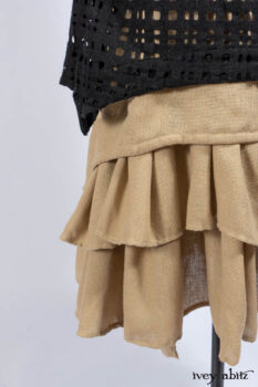 Limited Edition Coulson Cardigan in Signature Black Ribbed Knit; Clotaire Sash in Riverside Floral Silk Chiffon; Bedloe Frock in Mansard Roof Open Woolen Weave; Everett Frock in Uptown Washed Weave.