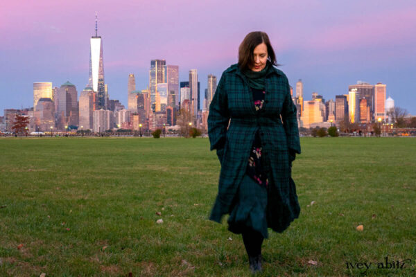 Inglenook Duster Coat in Riverside Black Watch Double Layered Weave; Nook Frock in Riverside Floral Silk Chiffon; Inglenook Frock in Riverside Plaid Cotton; Lydia Neck Wrap and Lydia Gloves in Signature Black Washed Knit.