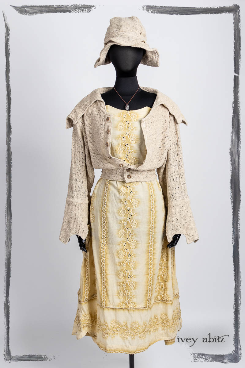 Furtherafield Jacket in Beach Cottage Soft Spun Weave; Harrison Frock in High Tea Embroidered Voile; Hapgood Hat in Beach Cottage Soft Spun Weave; Nouvelle Necklace. Bespoke clothing by Ivey Abitz.