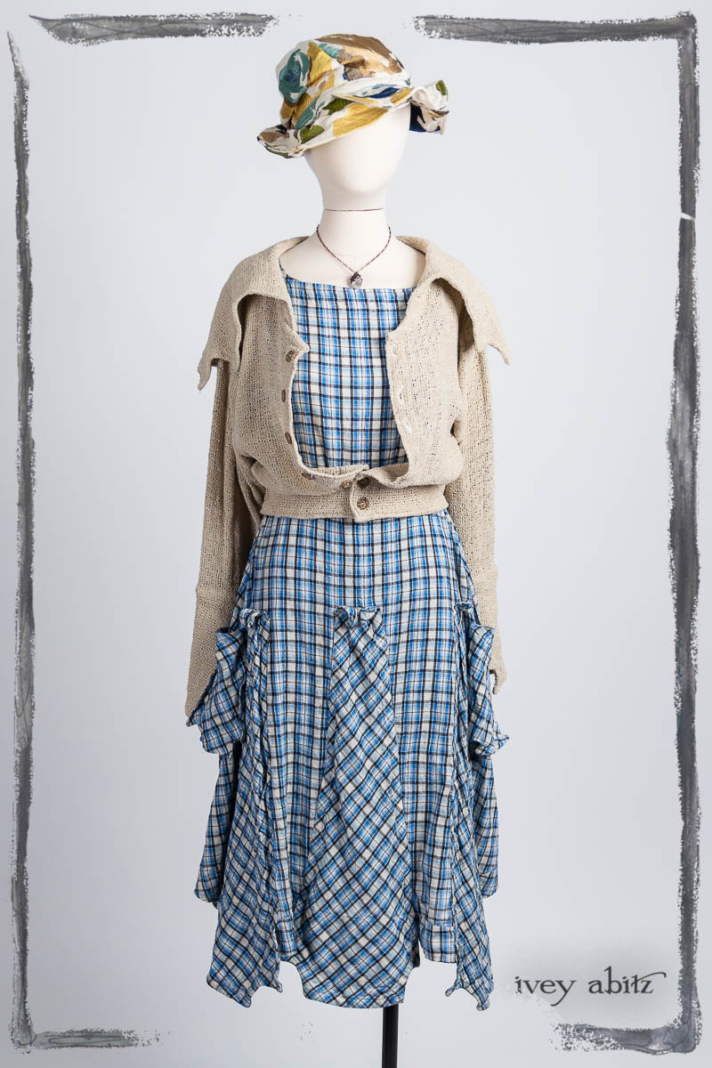 Furtherafield Jacket in Beach Cottage Soft Spun Weave; Furtherafield Frock in Seaside Woven Plaid; Hapgood Hat in Floral Embroidered Weave; Nouvelle Necklace. Bespoke clothing by Ivey Abitz.