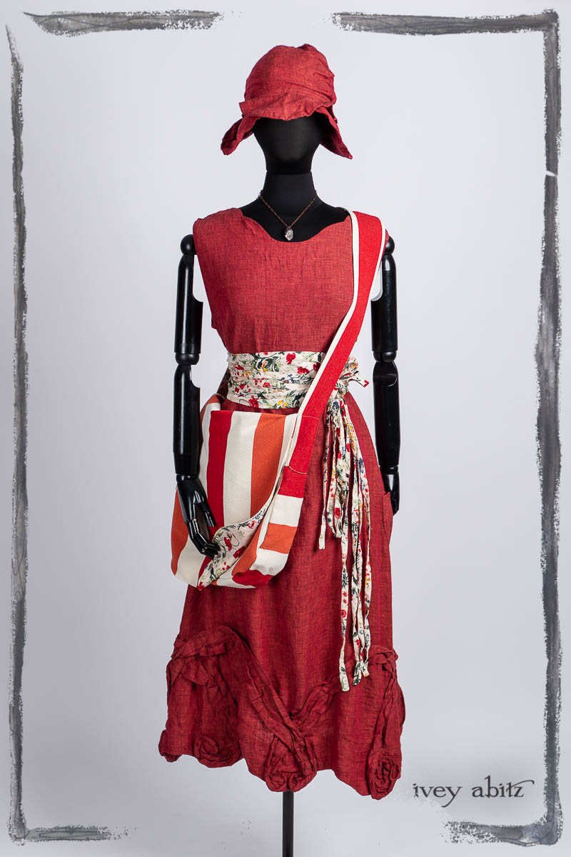 Bartholdi Frock in Poppy Washed Linen; Solomon Bag in Poppy Stripe Soft Canvas, Porte Cochere Sash in Poppy Garden Weave; Hapgood Hat in Poppy Washed Linen; Nouvelle Necklace. Bespoke clothing by Ivey Abitz.