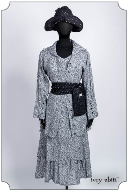 Pierrepont Shirt in Grey Gardens Petite Fleur Voile; Voyage Satchel in Noir Embroidered Circle Linen; Liberté Frock in Grey Gardens Petite Fleur Voile; Hapgood Hat in Noir Embroidered Circle Linen. Bespoke clothing by Ivey Abitz.