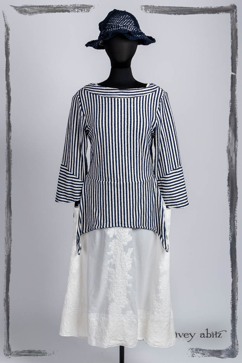 Cossart Top in Bastille Blue Textured Stripe; Limited Edition Covante Frock in Blanche Embroidered Stripe Voile; Hapgood Hat in Bastille Blue Open Weave Knit. Bespoke clothing by Ivey Abitz.