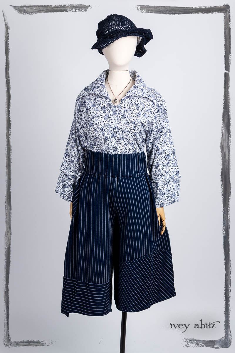 Baedeker Shirt in Bastille Blue Fleur Cotton; Cossart Culottes in Bastille Blue Stripe Knit; Hapgood Hat in Bastille Blue Open Weave Knit. Bespoke clothing by Ivey Abitz.