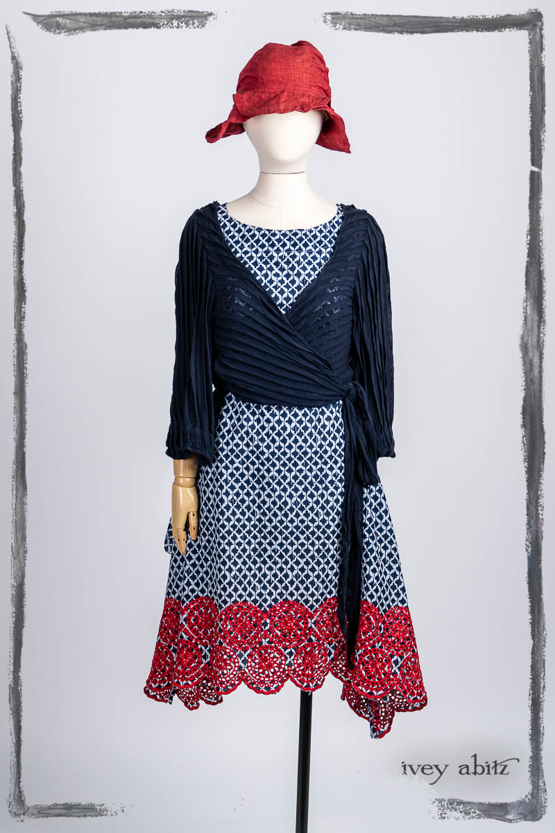 Vallonné Jacket in Bastille Blue Flutter Pleat Knit; Pique-nique Frock in Bastille Blue and Poppy Embroidered Weave; Hapgood Hat in Poppy Washed Linen. Bespoke clothing by Ivey Abitz.