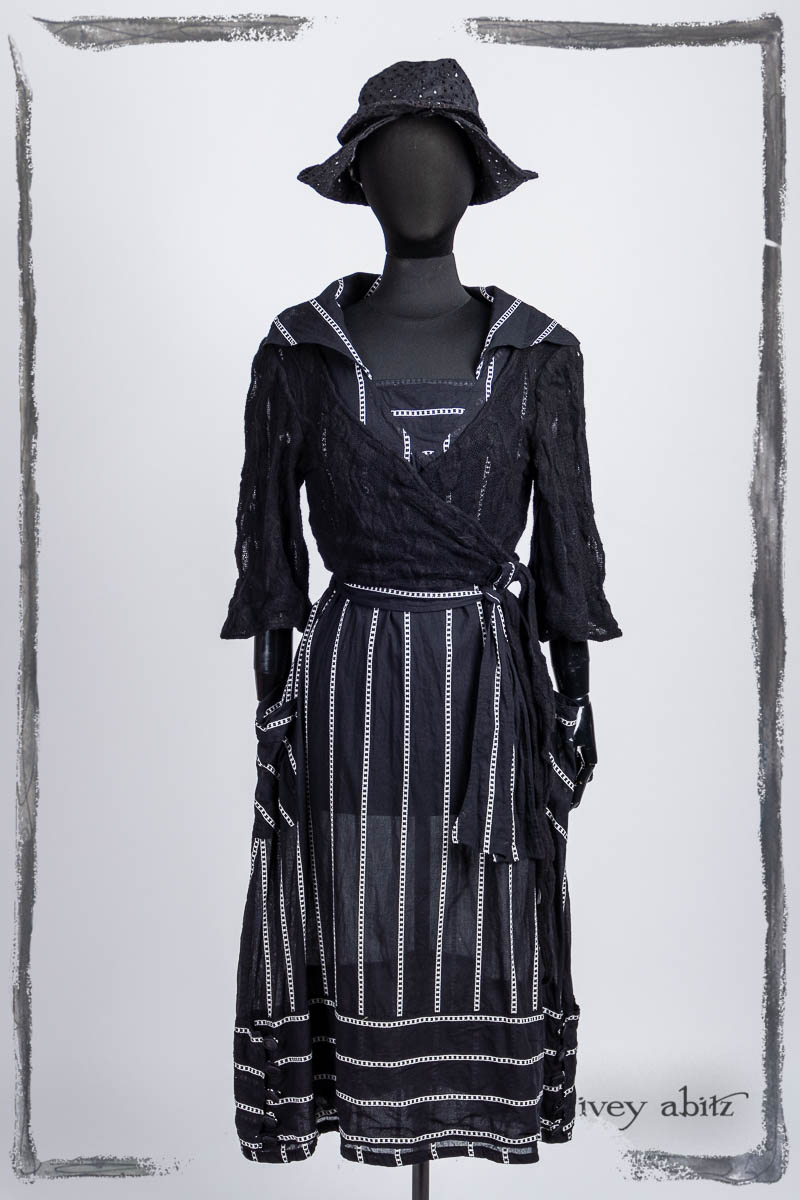 Viv Frock in Noir Embroidered Stripe Voile; Vallonné Jacket in Noir Embroidered Lace Knit; Hapgood Hat in Noir Circle Embroidered Linen. Bespoke clothing by Ivey Abitz.
