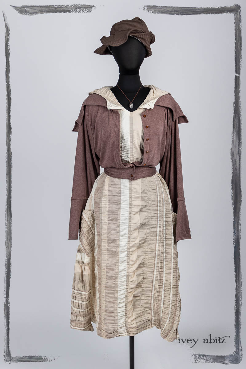 Furtherafield Jacket in Clapboard Cottage Softest Knit; Limited Edition Etta Frock in Beach Cottage Puckered Stripe; Hapgood Hat in Clapboard Cottage Ribbed Weave; Nouvelle Necklace. Bespoke clothing by Ivey Abitz.