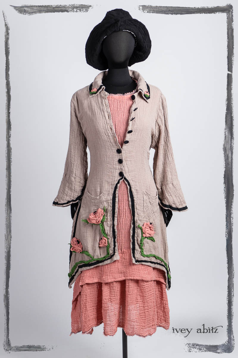 Chaumont Duster Coat in Signature Sand Washed Crinkled Weave; Limited Edition Blanchfleur Frock in Parisienne Rose Washed Crinkled Weave; Hapgood Hat in Noir Puckered Knit. Bespoke clothing by Ivey Abitz.