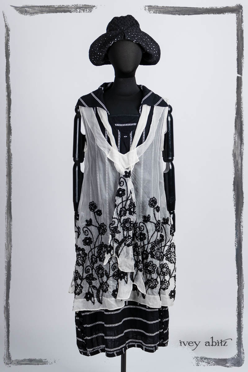 Ettienne Frock in Noir and Blanche Embroidered Silk Organza, Ettienne Sash in Noir and Blanche Embroidered Silk Organza; Viv Frock in Noir Embroidered Stripe Voile; Hapgood Hat in Noir Circle Embroidered Linen. Bespoke clothing by Ivey Abitz.
