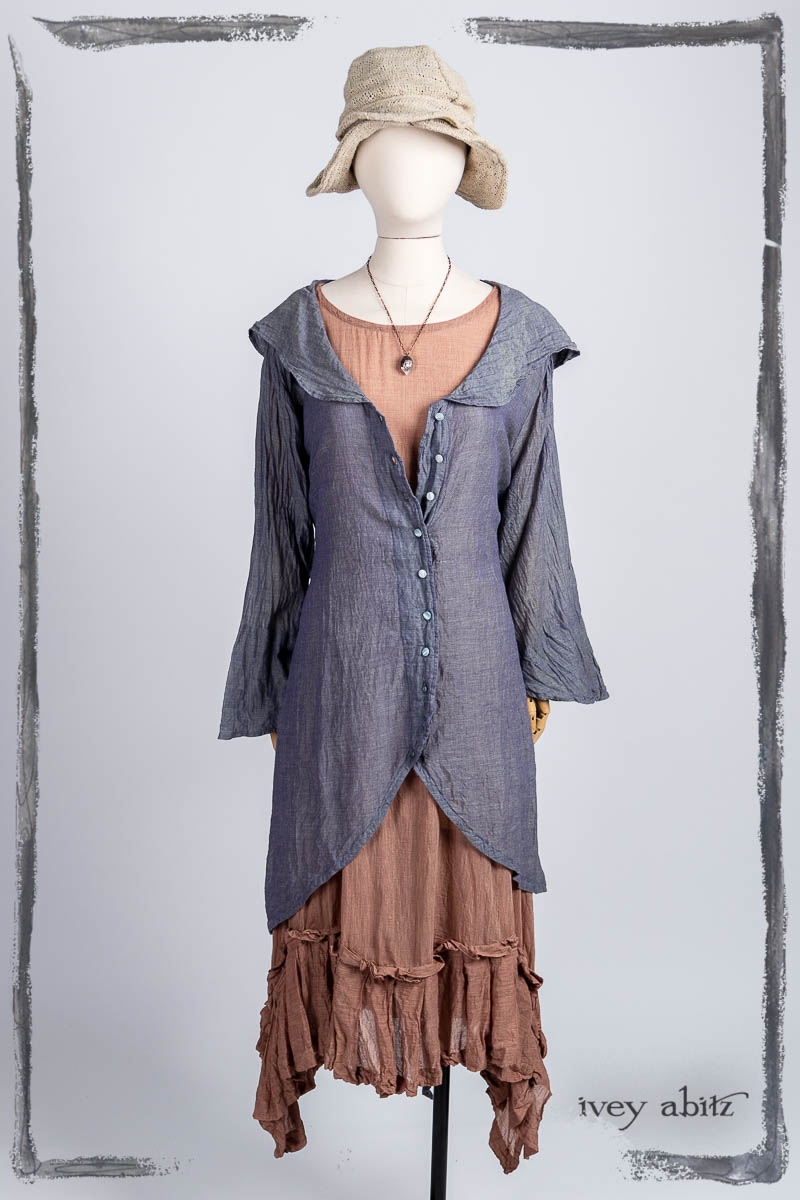 Arthur Hill Duster Coat in Bluebell Cross-woven Washed Voile; Fairholme Frock in Art Deco Washed Voile; Hapgood Hat in Beach Cottage Soft Spun Weave; Nouvelle Necklace. Bespoke clothing by Ivey Abitz.