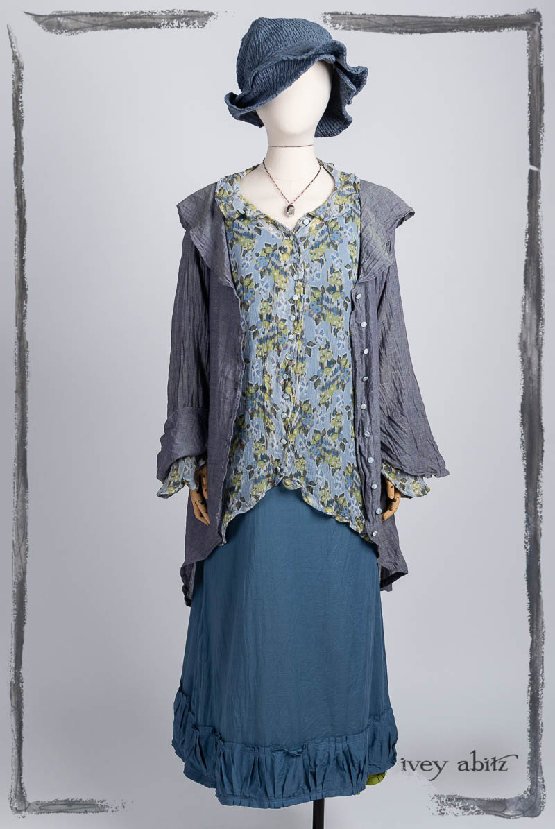 Arthur Hill Duster Coat in Bluebell Cross Woven Washed Voile; Arthur Hill Shirt in Bluebell Floral Silk Chiffon; Gabled Frock in Bluebell Washed Batiste; Hapgood Hat in Bluebell Puckered Weave; Nouvelle Necklace. Bespoke clothing by Ivey Abitz.