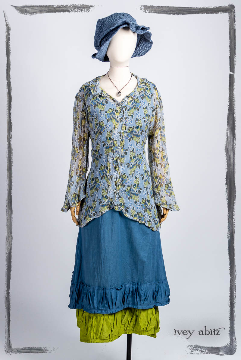 Arthur Hill Shirt in Bluebell Floral Silk Chiffon; Gabled Frock in Bluebell Washed Batiste; Gabled Frock in Plucky Washed Batiste; Hapgood Hat in Bluebell Puckered Hat Weave; Nouvelle Necklace. Bespoke clothing by Ivey Abitz.