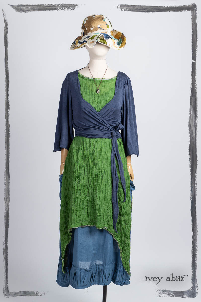 Vallonné Jacket in Bluebell Washed Silk Jersey Knit; Cape Frock in Plucky Washed Linen; Limited Edition Wildefield Frock in Plucky Washed Crinkled Weave; Hapgood Hat in Floral Embroidered Weave; Nouvelle Necklace. Bespoke clothing by Ivey Abitz.