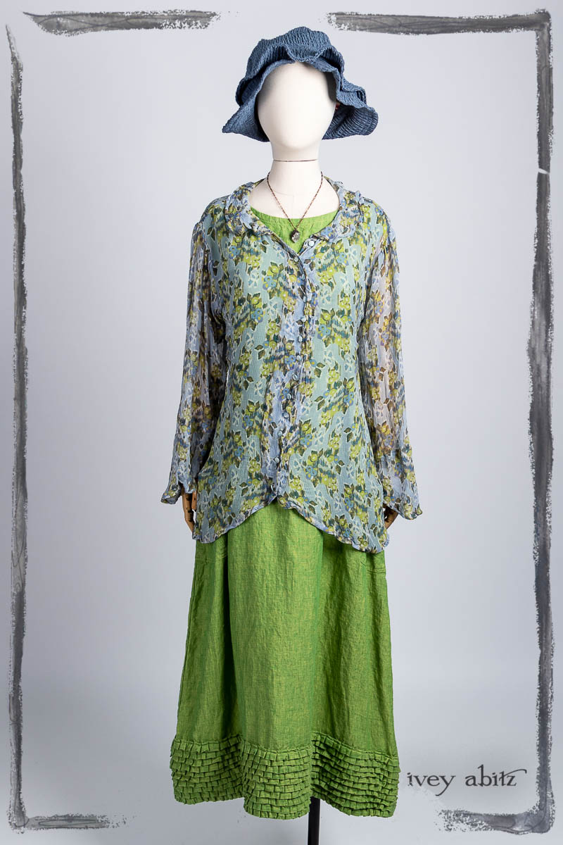 Arthur Hill Shirt in Bluebell Floral Silk Chiffon; Cape Frock in Plucky Washed Linen; Hapgood Hat in Bluebell Puckered Hat Weave; Nouvelle Necklace. Bespoke clothing by Ivey Abitz.