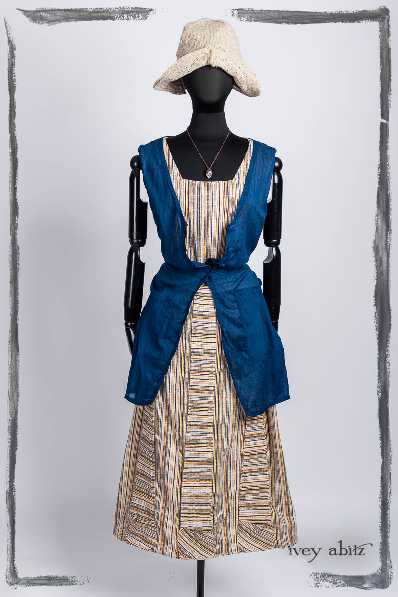 Campanella Overlay in Seaside Washed Batiste; Campanella Frock in Primary Stripe Weave; Hapgood Hat in Beach Cottage Soft Spun Weave; Nouvelle Necklace. Bespoke clothing by Ivey Abitz.