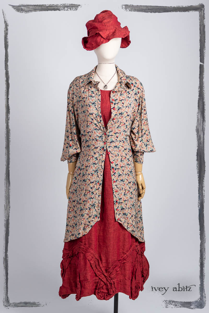 Truitt Shirt Jacket in Veranda Fleur Stretch Silk Charmeuse; Bartholdi Jacket in Poppy Washed Linen; Hapgood Hat in Poppy Washed Linen; Nouvelle Necklace. Bespoke clothing by Ivey Abitz.