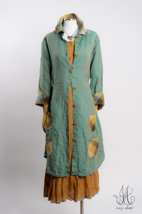 Rosemarie Duster Coat in Sea Foam Washed Weave with Plaid Detail; Rennie Frock in Ripe Apricot Washed Weave; Heirloom Necklace.